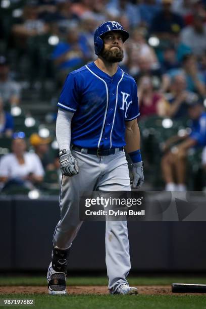 Alex Gordon of the Kansas City Royals reacts after being hit by a pitch in the ninth inning against the Milwaukee Brewers at Miller Park on June 27,...