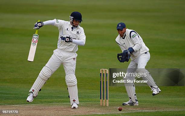 Warwickshire batsman Neil Carter cuts a ball watched by Hampshire wicketkeeper Nic Pothas during day two of the LV County Championship division one...