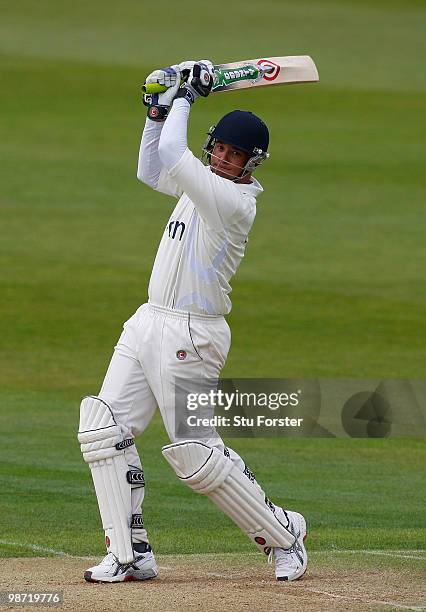 Warwickshire batsman Neil Carter cuts a ball to the boundary during day two of the LV County Championship division one match between Warwickshire and...