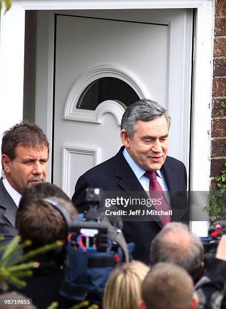 Prime Minister Gordon Brown leaves the home of pensioner Gillian Duffy after making an apology for referring to her as a 'bigoted woman', on April...