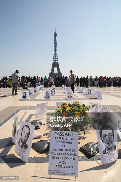Pictures of Chernobyl's victims are shown on April 24, 2010 on the Trocadero esplanade in front of the Eiffel tower in Paris, as part of a rally...