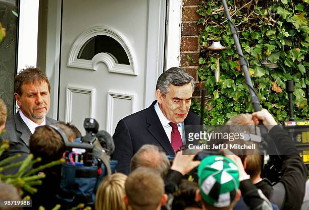 Prime Minister Gordon Brown leaves the home of pensioner Gillian Duffy after making an apology for referring to her as a 'bigoted woman', on April...