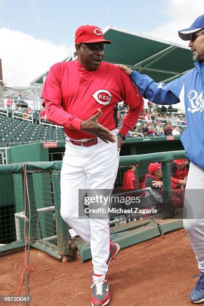 Manger Dusty Baker of the Cincinnati Reds talking with Manger Trey Hillman prior to the game between the Reds and the Royals during the MLB spring...