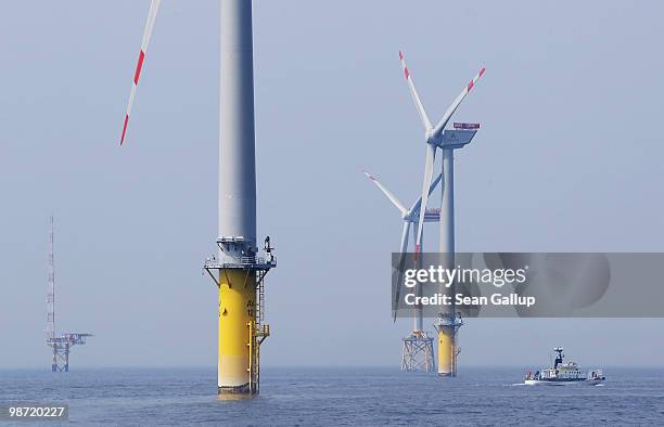 Ship passes by wind turbines at the Alpha Ventus offshore windpark on April 28, 2010 in the North Sea approximately 70km north of the German coast....