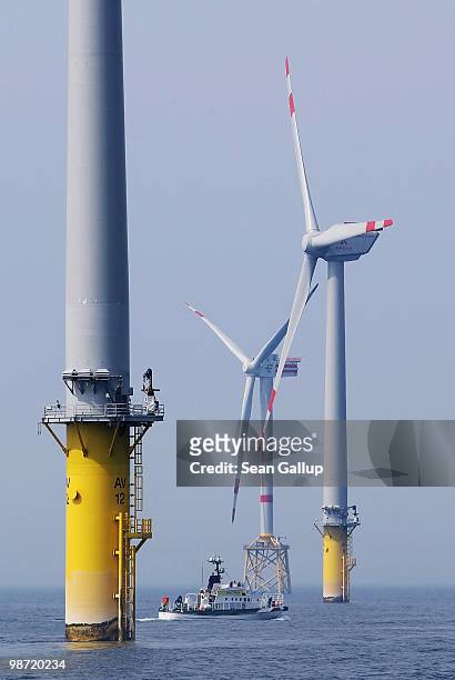 Ship passes by wind turbines at the Alpha Ventus offshore windpark on April 28, 2010 in the North Sea approximately 70km north of the German coast....