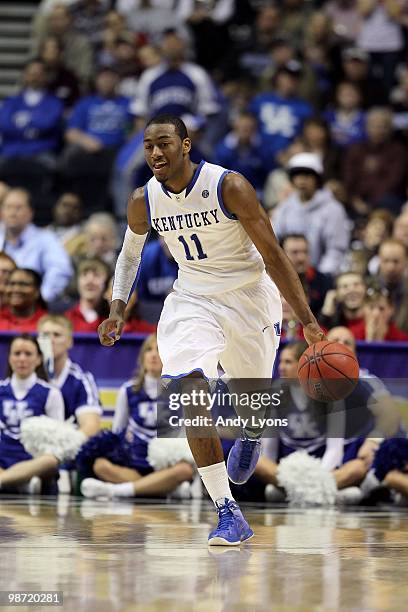 John Wall of the Kentucky Wildcats brings the ball up court against the Alabama Crimson Tide during the quarterfinals of the SEC Men's Basketball...