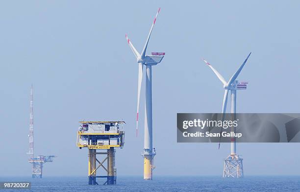 Wind turbines spin at the Alpha Ventus offshore windpark on April 28, 2010 in the North Sea approximately 70km north of the German coast. Alpha...