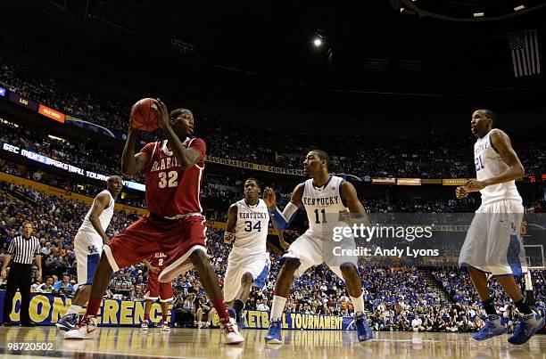 Jamychal Green of the Alabama Crimson Tide looks to move the ball against John Wall of the Kentucky Wildcats during the quarterfinals of the SEC...