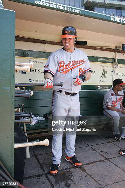 Garrett Atkins of the Baltimore Orioles standing in the dugout prior to the game against the Oakland Athletics at the Oakland Coliseum in Oakland,...