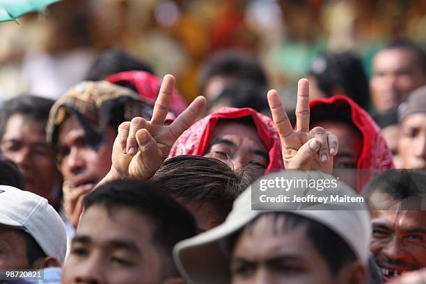 Supporter of Buluan Vice Mayor and candidate for governor of Maguindanao Esmael "Toto" Mangudadatu, gestures during campaign stop on April 28, 2010...