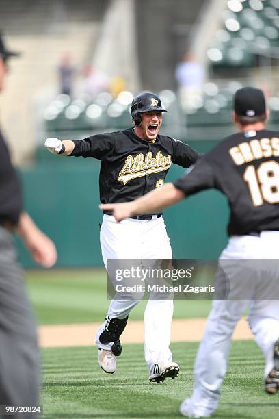 Ryan Sweeney of the Oakland Athletics celebrating his game winning walk-oof hit during the game against the Baltimore Orioles at the Oakland Coliseum...