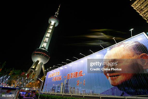 Portrait of Chinese former leader Deng Xiaoping is seen near the Oriental Pearl TV Tower on April 28, 2010 in Shanghai, China. The World Expo will be...