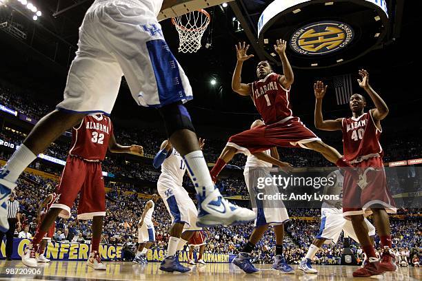Anthony Brock of the Alabama Crimson Tide defends against an inbounds pass by the Kentucky Wildcats during the quarterfinals of the SEC Men's...