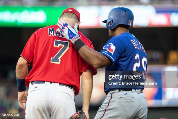 Adrian Beltre of the Texas Rangers talks with Joe Mauer of the Minnesota Twins on June 22, 2018 at Target Field in Minneapolis, Minnesota. The...