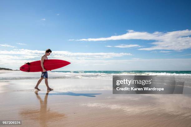 surfer_1 - red white and blue beach stock pictures, royalty-free photos & images