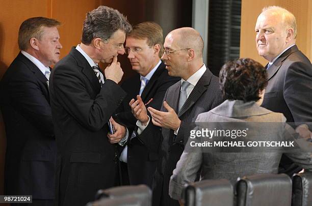 Joerg Asmussen , Secretary of Federal Ministry of Finance of Germany gestures as he speaks with participants of a high-level financial conference...