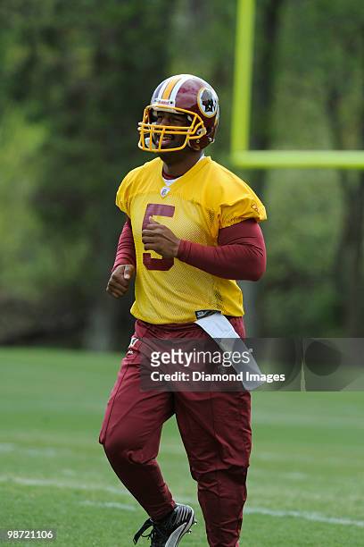 Quarterback Donovan McNabb of the Washington Redskins jogs towards the next drill location during a mini camp on April 18, 2010 at Redskins Park in...