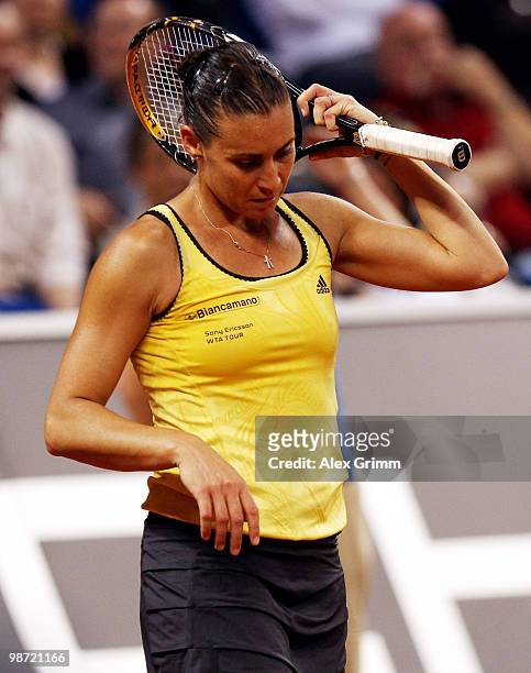 Flavia Pennetta of Italy reacts during her first round match against Victoria Azarenka of Belarus at day three of the WTA Porsche Tennis Grand Prix...