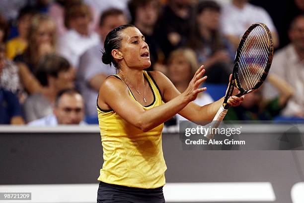 Flavia Pennetta of Italy reacts during her first round match against Victoria Azarenka of Belarus at day three of the WTA Porsche Tennis Grand Prix...