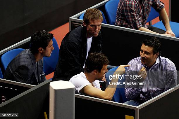 Ciprian Marica , Zdravko Kuzmanovic and Aliaksandr Hleb of VfB Stuttgart watch the first round match between Victoria Azarenka of Belarus and Flavia...