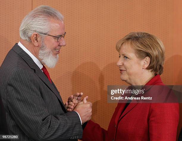 German Chancellor Angela Merkel welcomes Juan Somavia, director general of the International Labour Organization prior to a meeting at the...