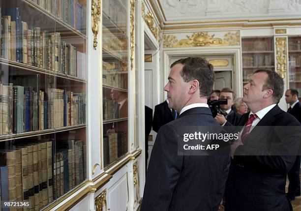 Russian President Dmitry Medvedev and Danish Prime Minister Lars Loekke Rasmussen look at Christiansborg Palace's Queen's Library in Copenhagen on...