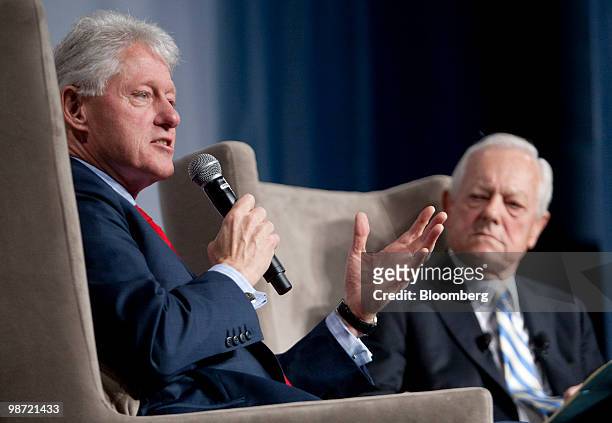 Former U.S. President Bill Clinton, left, speaks to CBS news anchor Bob Schieffer during the Peter G. Peterson Foundation fiscal summit in...