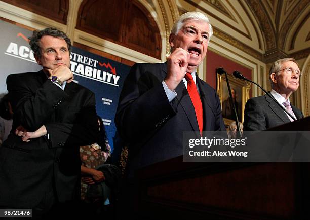 Sen. Christopher Dodd speaks as Senate Majority Leader Sen. Harry Reid and Sen. Sherrod Brown listen during a news conference April 28, 2010 on...