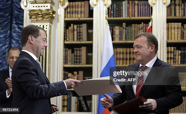 Russian President Dmitry Medvedev and Danish Prime Minister Lars Loekke Rasmussen exchange documents at a signing ceremony at Christiansborg Palace's...