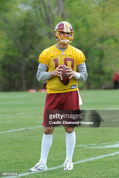 Quarterback Richard Bartel of the Washington Redskins sets up to throw a pass during a mini camp on April 18, 2010 at Redskins Park in Ashburn,...