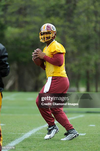 Quarterback Donovan McNabb of the Washington Redskins drops back to throw a pass during a mini camp on April 18, 2010 at Redskins Park in Ashburn,...