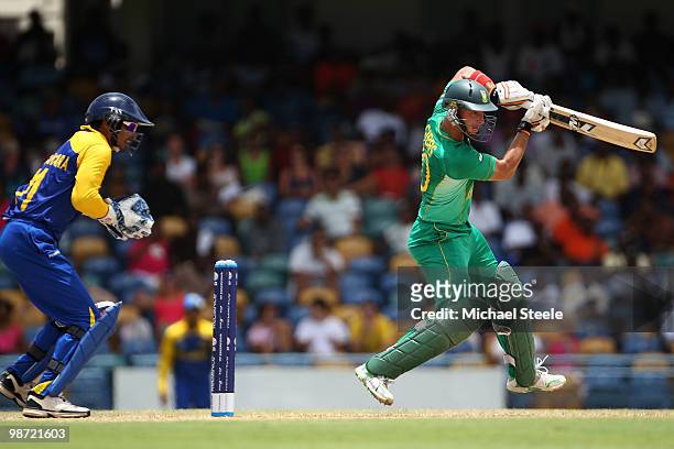 Herschelle Gibbs of South Africa plays to the onside as Kumar Sangakkara looks on during The ICC T20 World Cup warm up match between Sri Lanka and...