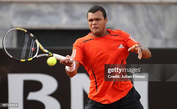 Jo-Wilfried Tsonga of France plays a forehand in his match against Viktor Troicki of Serbia during day four of the ATP Masters Series - Rome at the...