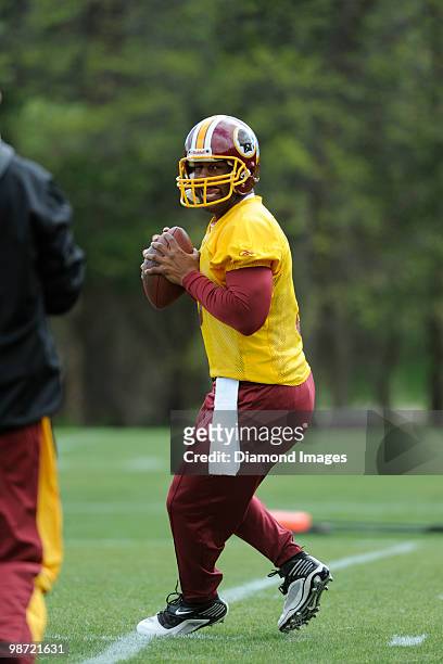 Quarterback Donovan McNabb of the Washington Redskins drops back to throw a pass during a mini camp on April 18, 2010 at Redskins Park in Ashburn,...