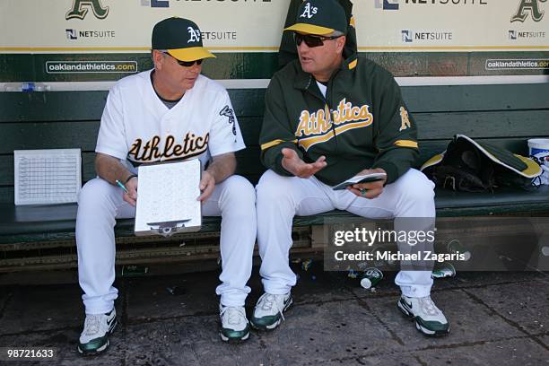 Oakland Athletics Manager Bob Geren and Pitching Coach Curt Young talking in the dugout during the game against the Baltimore Orioles at the Oakland...