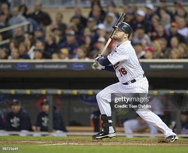 Jason Kubel of the Minnesota Twins follows through on a hit during an MLB game against the Kansas City Royals at Target Field on April 16, 2010 in...