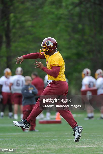 Quarterback Donovan McNabb of the Washington Redskins throws a pass during a mini camp on April 18, 2010 at Redskins Park in Ashburn, Virginia.