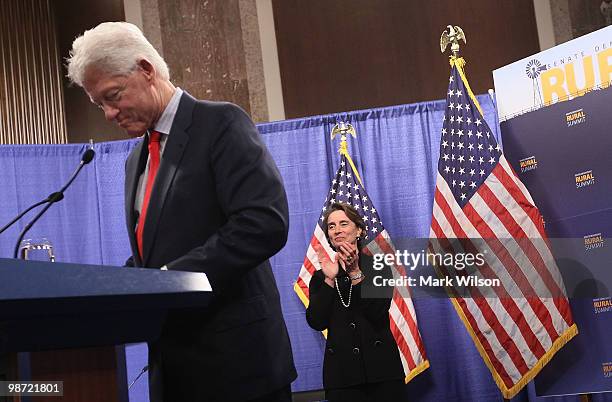 Former U.S. President Bill Clinton recieves applause while flanked by Senator Blanche Lincoln at the inaugural Rural Summit on April 28, 2010 in...