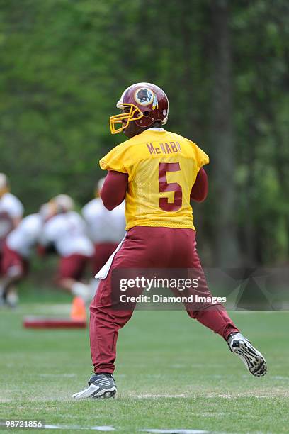 Quarterback Donovan McNabb of the Washington Redskins drops back to throw a pass during a mini camp on April 18, 2010 at Redskins Park in Ashburn,...