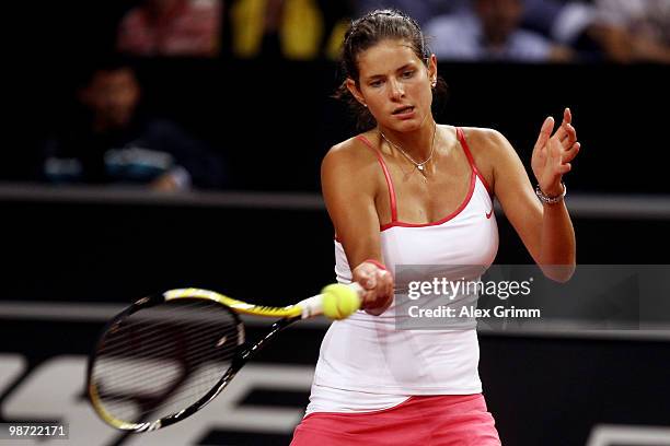 Julia Goerges of Germany plays a forehand during her first round match against Justine Henin of Belgium at day three of the WTA Porsche Tennis Grand...