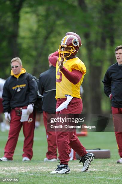 Quarterback Donovan McNabb of the Washington Redskins throws a pass during a mini camp on April 18, 2010 at Redskins Park in Ashburn, Virginia.