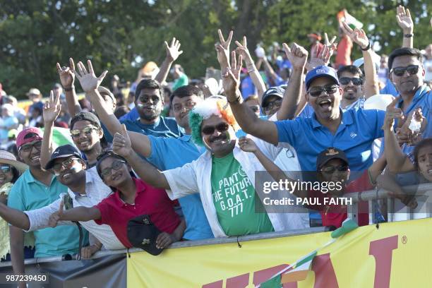 Indian supporters cheer their victory after the Twenty20 International cricket match between Ireland and India at Malahide cricket club, in Dublin on...