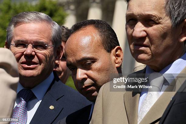 Rep. Luis Gutierrez is flanked by Sen. Robert Menendez and Rep. Dennis Kucinich during a news conference on immigration April 28, 2010 in Washington,...