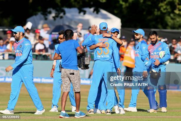 Indian players celebrate their victory after the Twenty20 International cricket match between Ireland and India at Malahide cricket club, in Dublin...