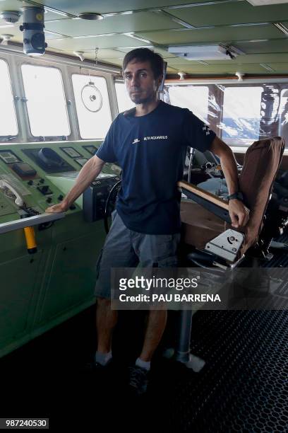 Italian Search and Rescue Coordinator Nicola Stalla member of SOS-Mediterranee NGO on board, poses on the bridge of the Aquarius rescue vessel,...