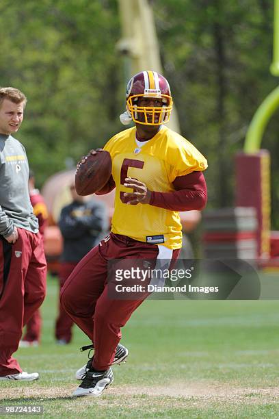 Quarterback Donovan McNabb of the Washington Redskins sets up to throw a pass during a mini camp on April 18, 2010 at Redskins Park in Ashburn,...