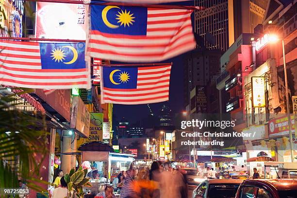 malaysian flags, petaling street, chinatown, kuala lumpur, malaysia, southeast asia, asia - petaling district stock pictures, royalty-free photos & images