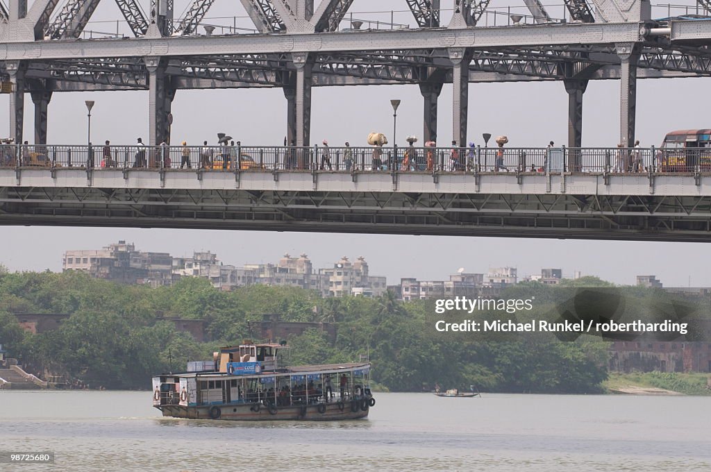 Passenger ferry under Howrah Bridge, Kolkata, West Bengal, India, Asia