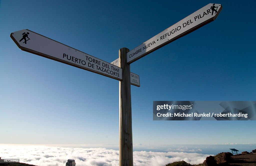 Signpost for trekkers above the clouds on top of the Taburiente, Canary Islands, Spain, Europe