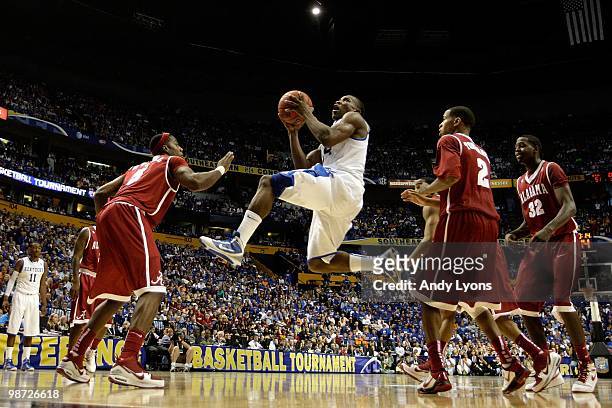 Eric Bledsoe of the Kentucky Wildcats drives for a shot attempt against the Alabama Crimson Tide during the quarterfinals of the SEC Men's Basketball...